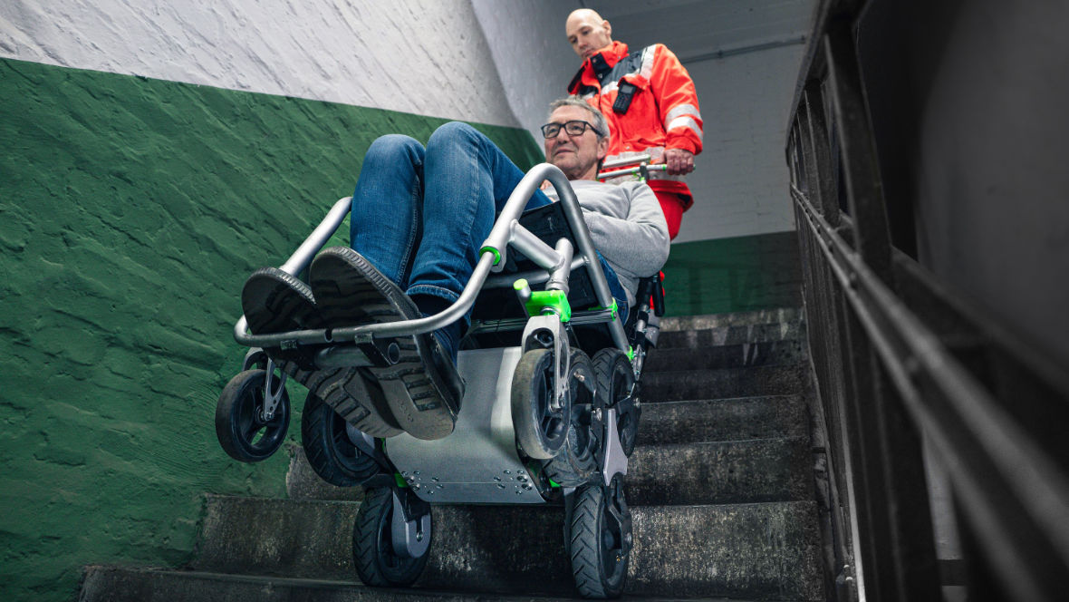 The Upstair transport aid in use with a patient on a staircase